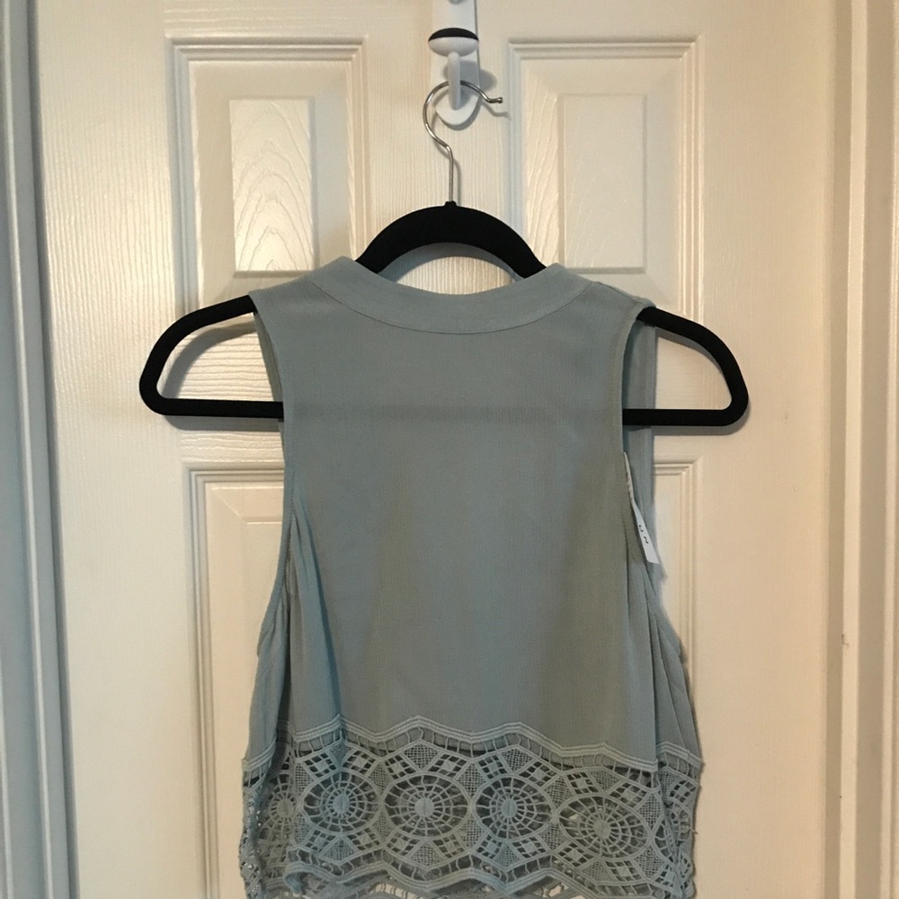 never worn, cute blue crop top with lace bottom